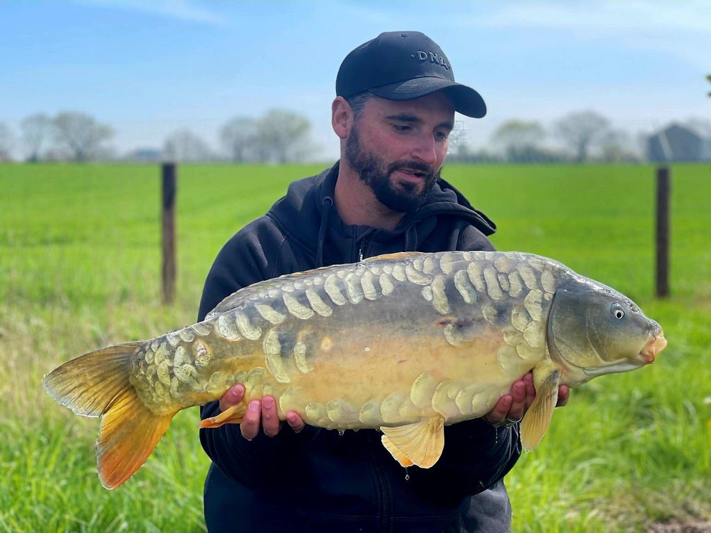 Shaun with a nice scaly mirror carp